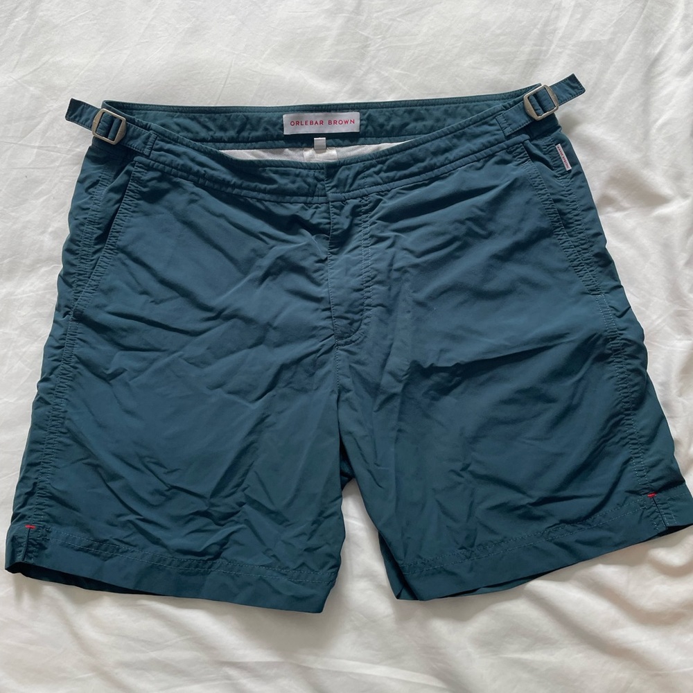 Classic ORLEBAR brown in a dark hunter green. Bulldog style (mid thigh length)